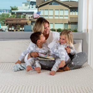 picture of mom and kids on the mattress